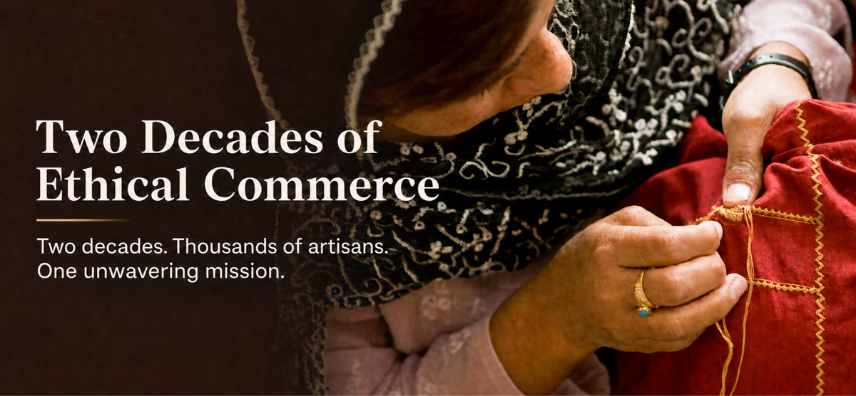 A close-up photo of an artisan sewing a red garment with gold embroidery, with overlaid text reading 'Two Decades of Ethical Commerce' and 'Two decades. Thousands of artisans. | Global Goods Partners