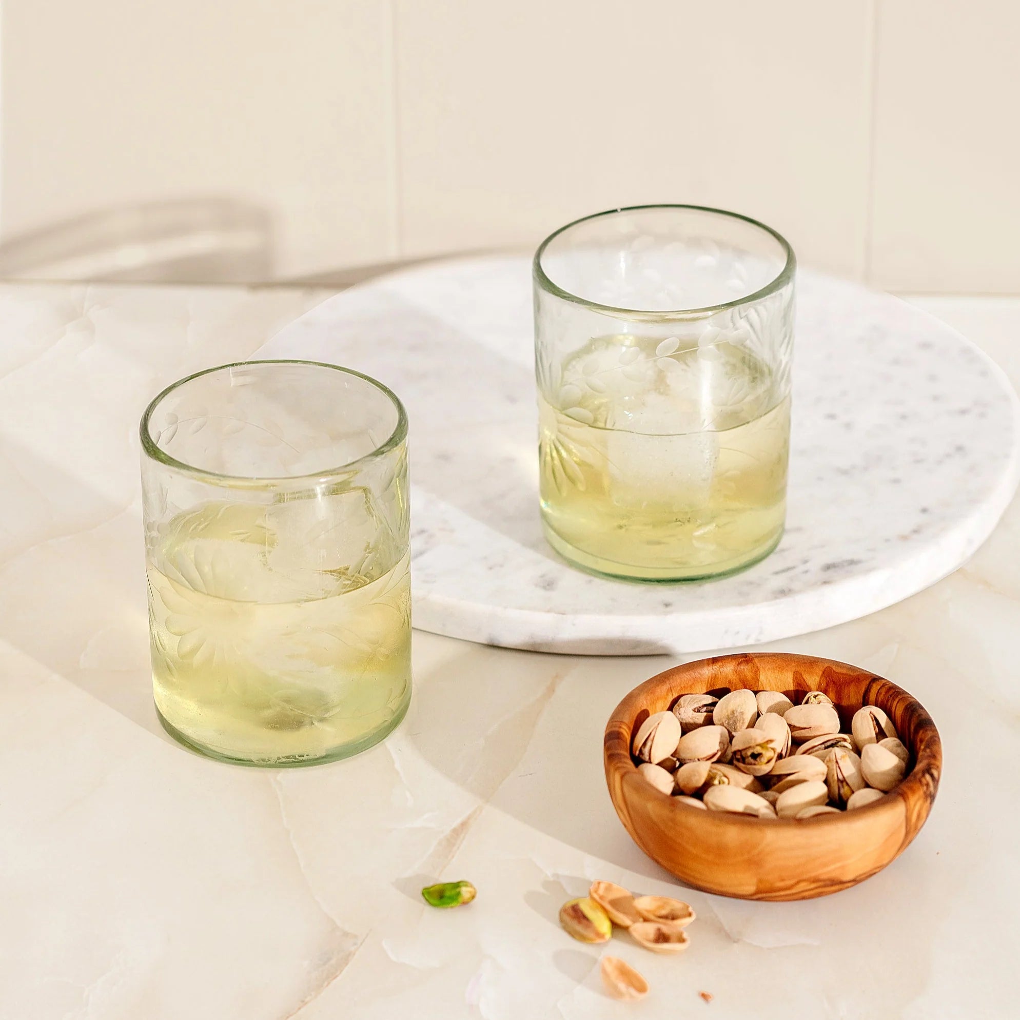 2 drinks with ice Clear Etched Glass Tumblers - Global Goods Partners