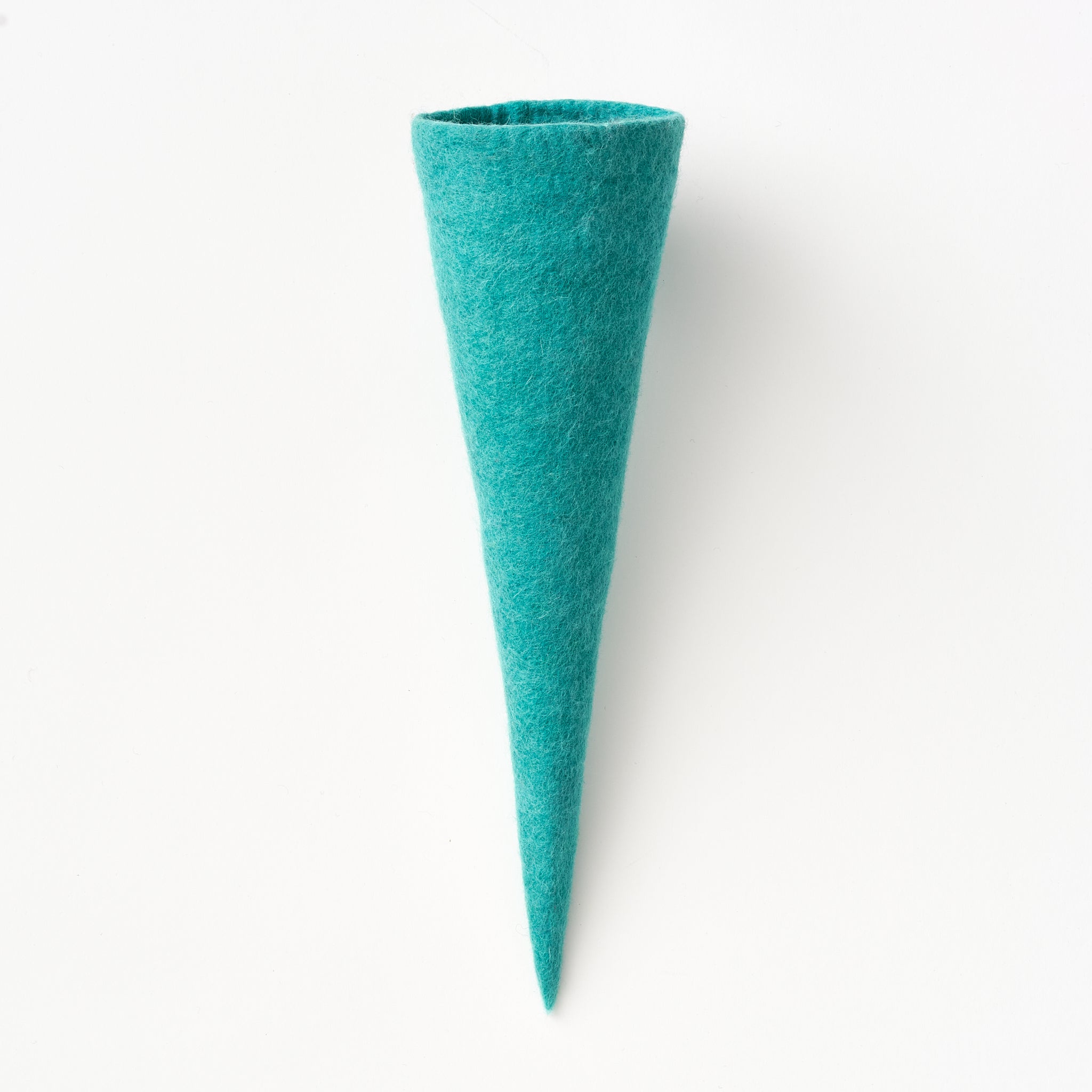 Teal felt vase on a white background. Handmade by women artisans in Nepal | Global Goods Partners