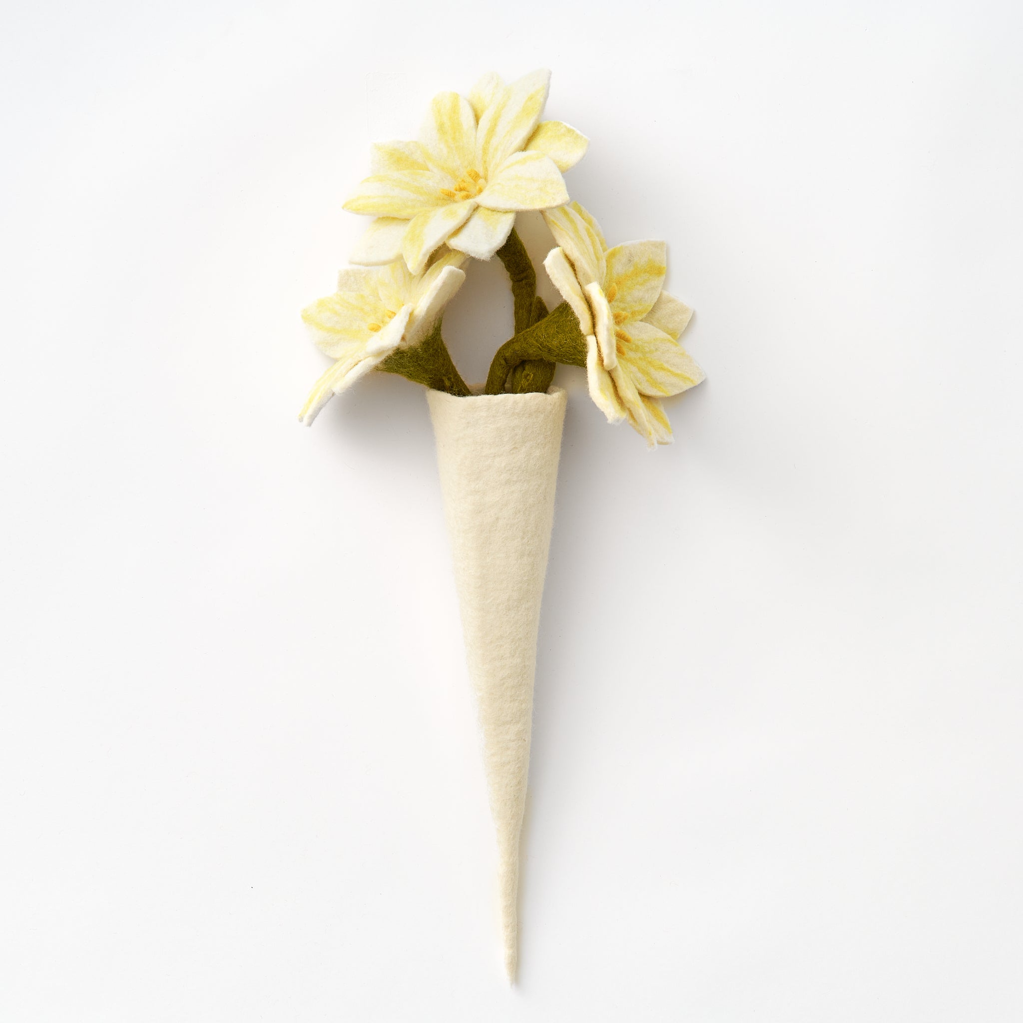 White handmade felt vase with yellow flowers on a white background | Global Goods Partners
