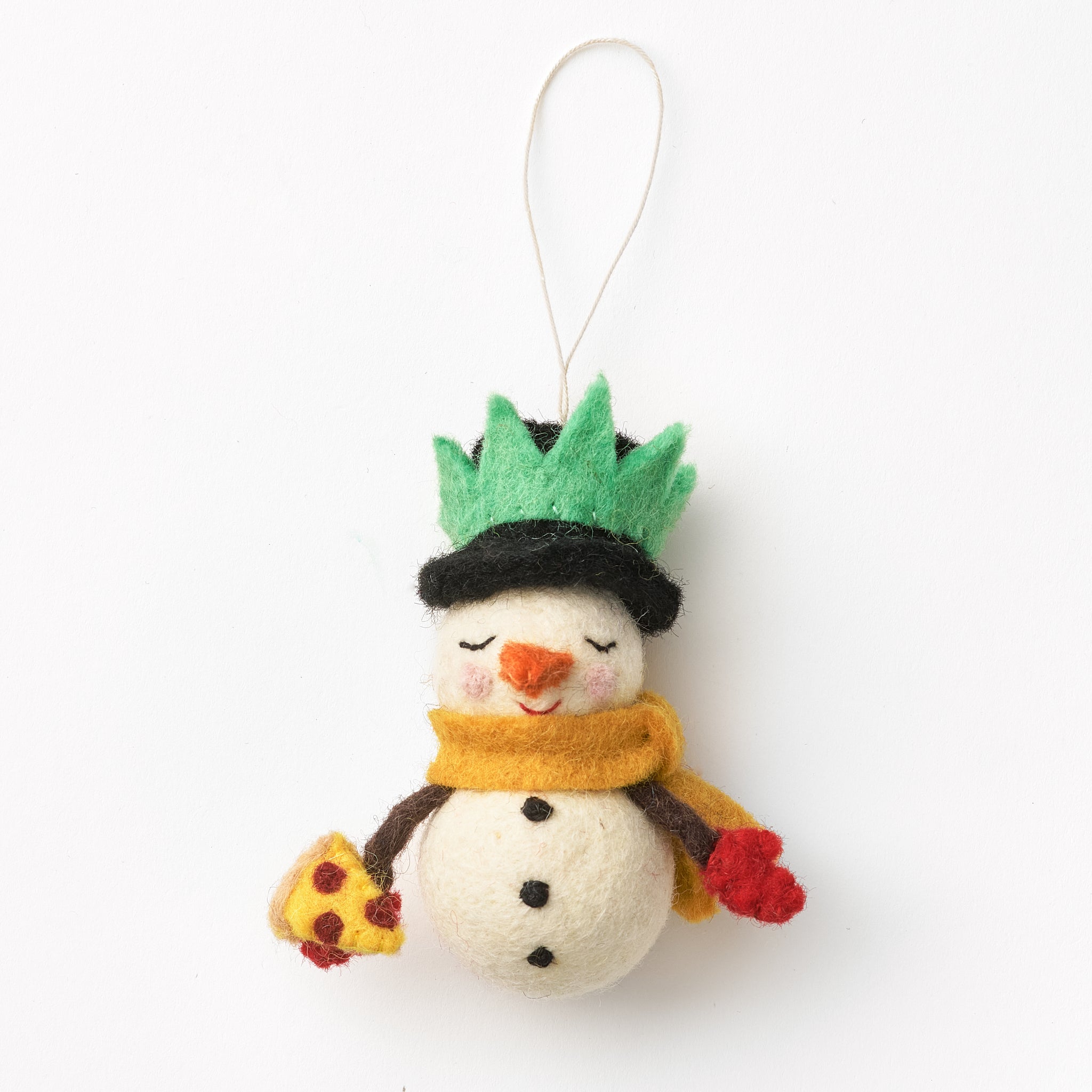 Handmade felted snowman ornament with a green hat, yellow scarf, and red gloves on a white background.