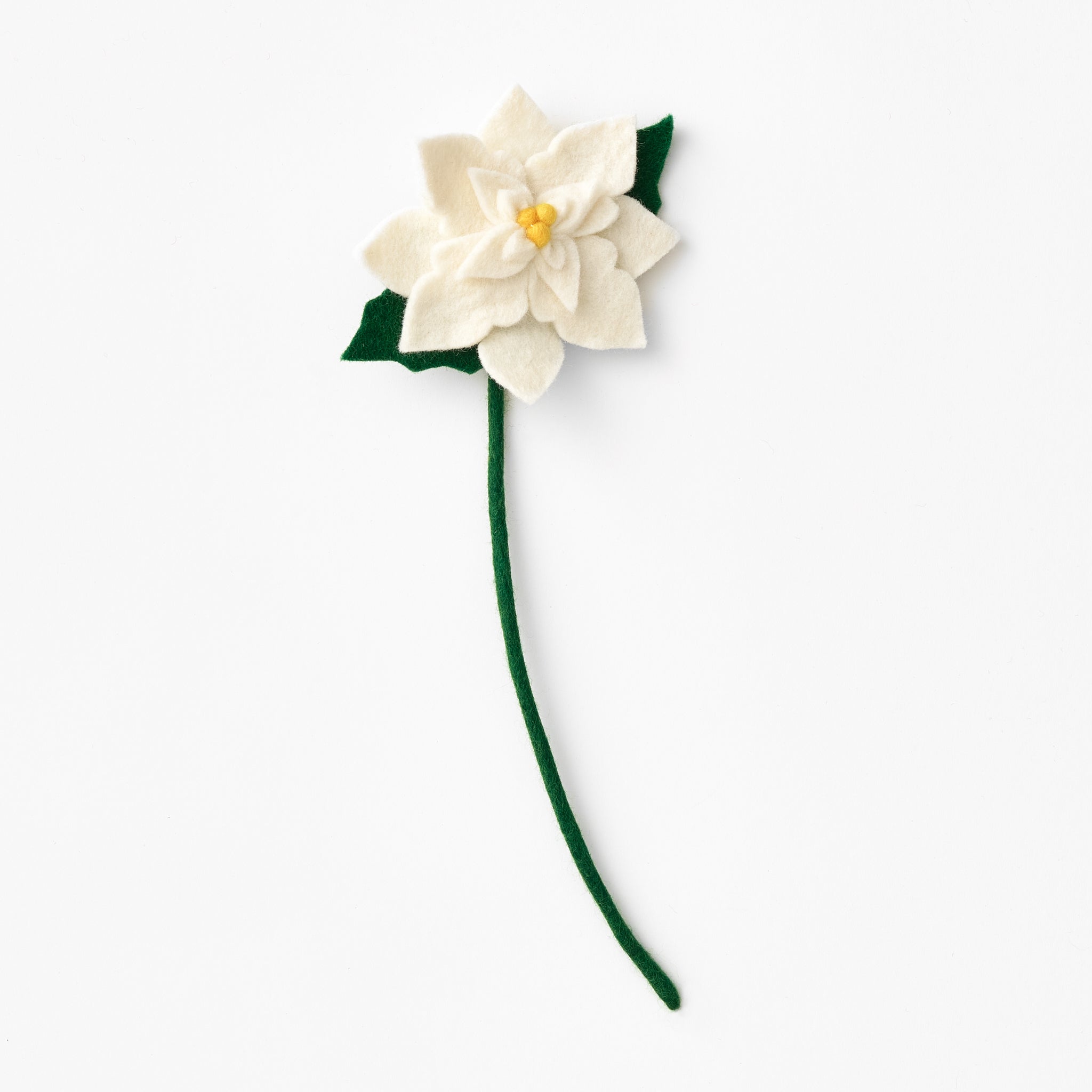 Handmade, felted white poinsettia flower with green stem on a white background. Fair trade flower made by women artisans | Global Goods Partners