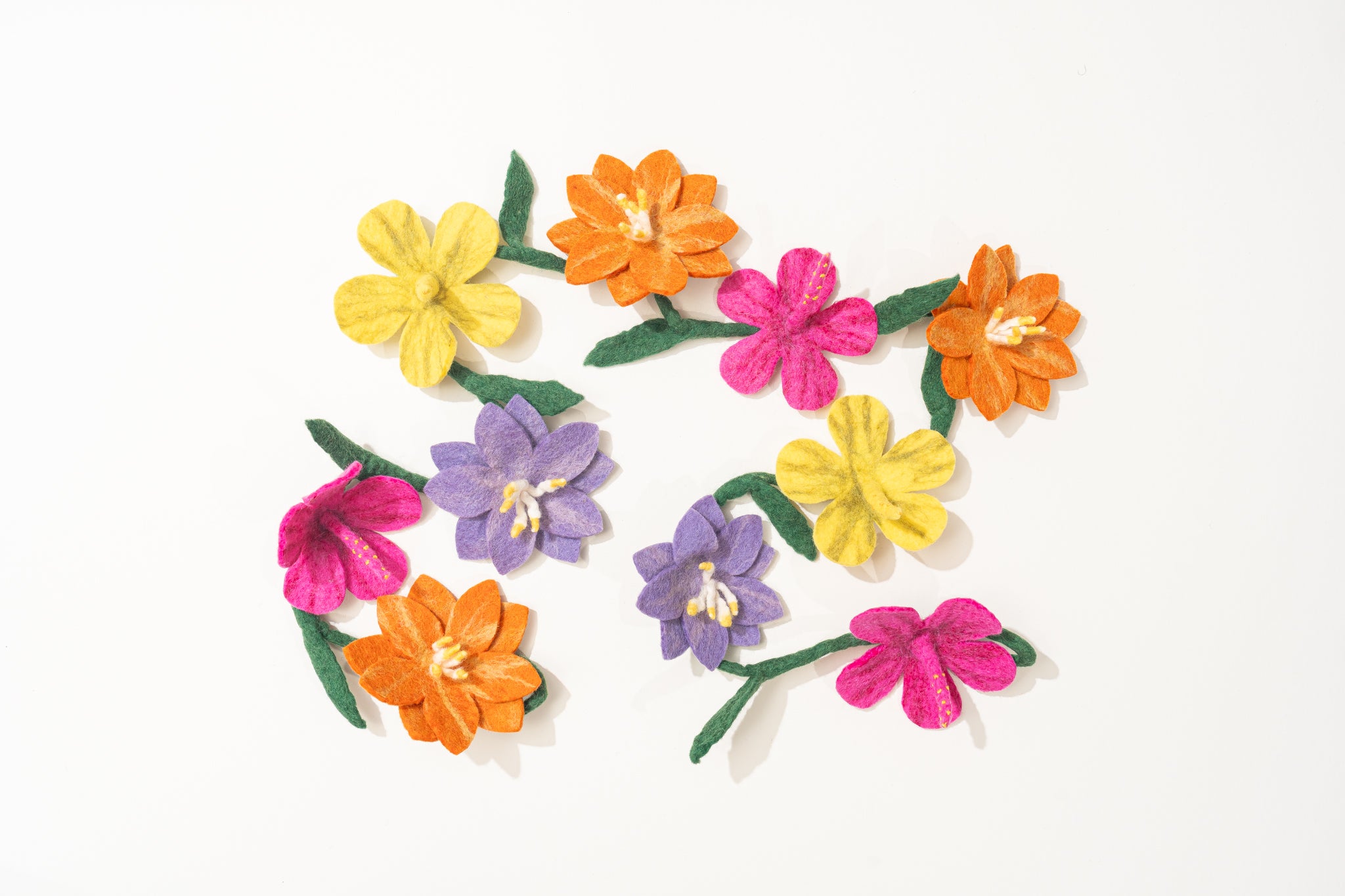 Colorful fair trade felt flower garland on a white background | Global Goods Partners