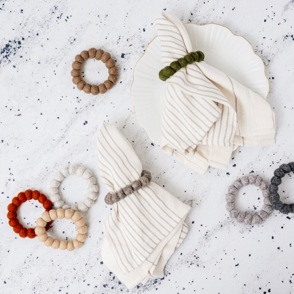 Felt Napkin Rings, Set of 4 Fall colors flat lay styled on plate -Fair Trade - Global Goods Partners