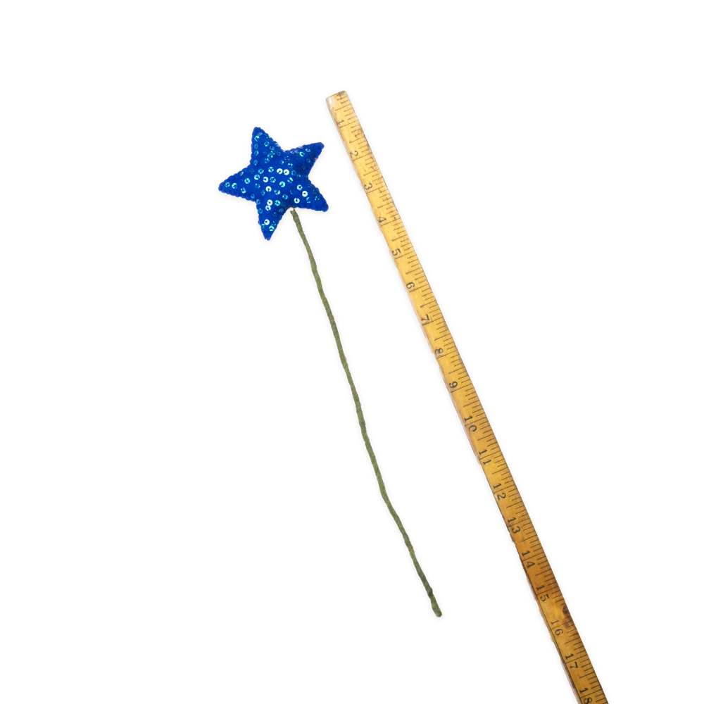 Blue star-shaped wand next to a ruler on a white background, fair trade | Global Goods Partners