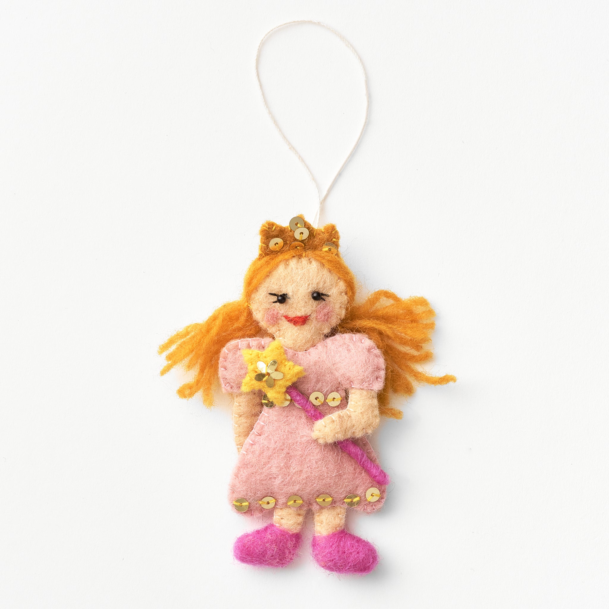 Artisan-made felt Glinda ornament with blonde hair and a pink dress holding a yellow star wand, hanging from a string on a white background | Global Goods Partners