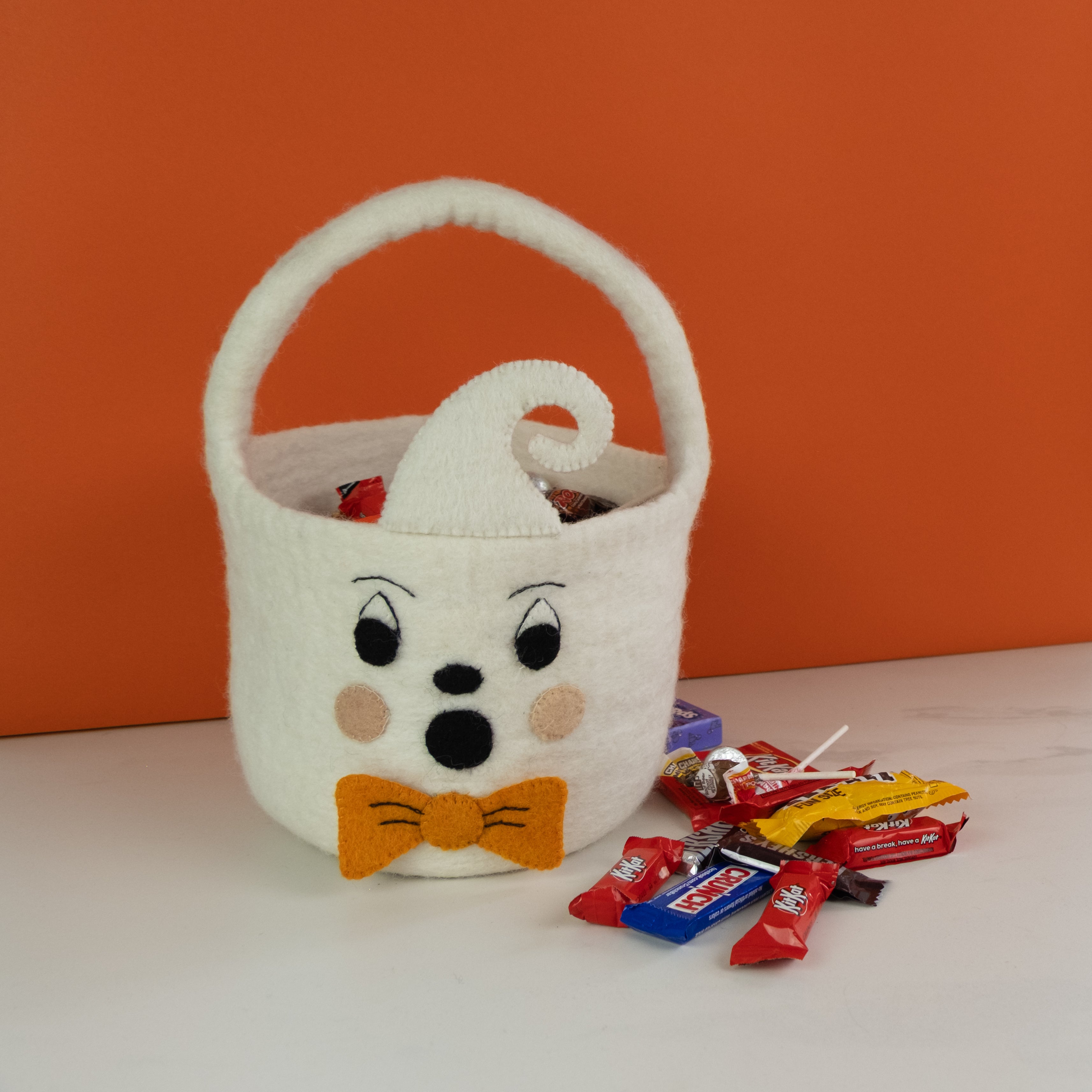 white ghost bucket made from fair trade felt - with candy for halloween trick or treat