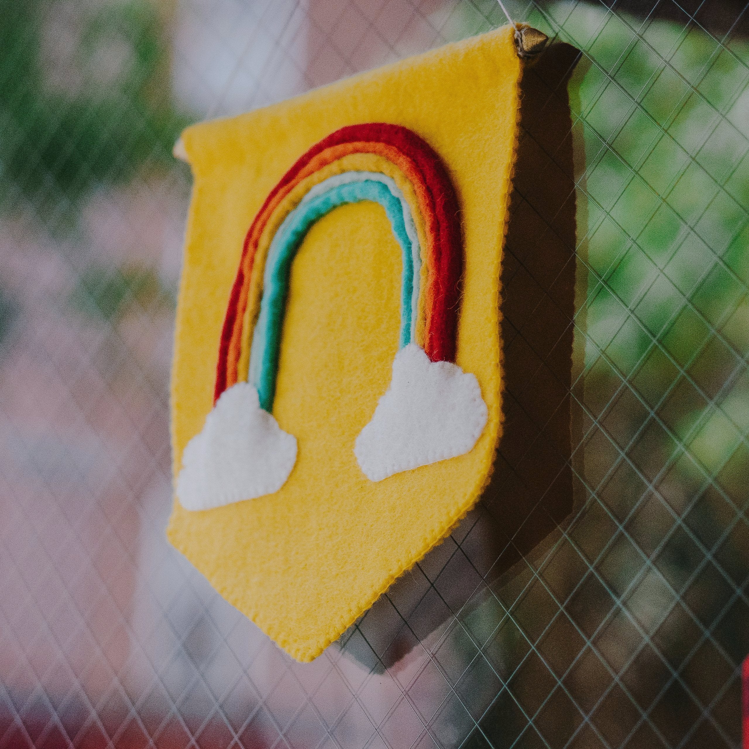 Yellow Felt Rainbow Banner Flag in a classroom -Fair Trade - Global Goods Partners