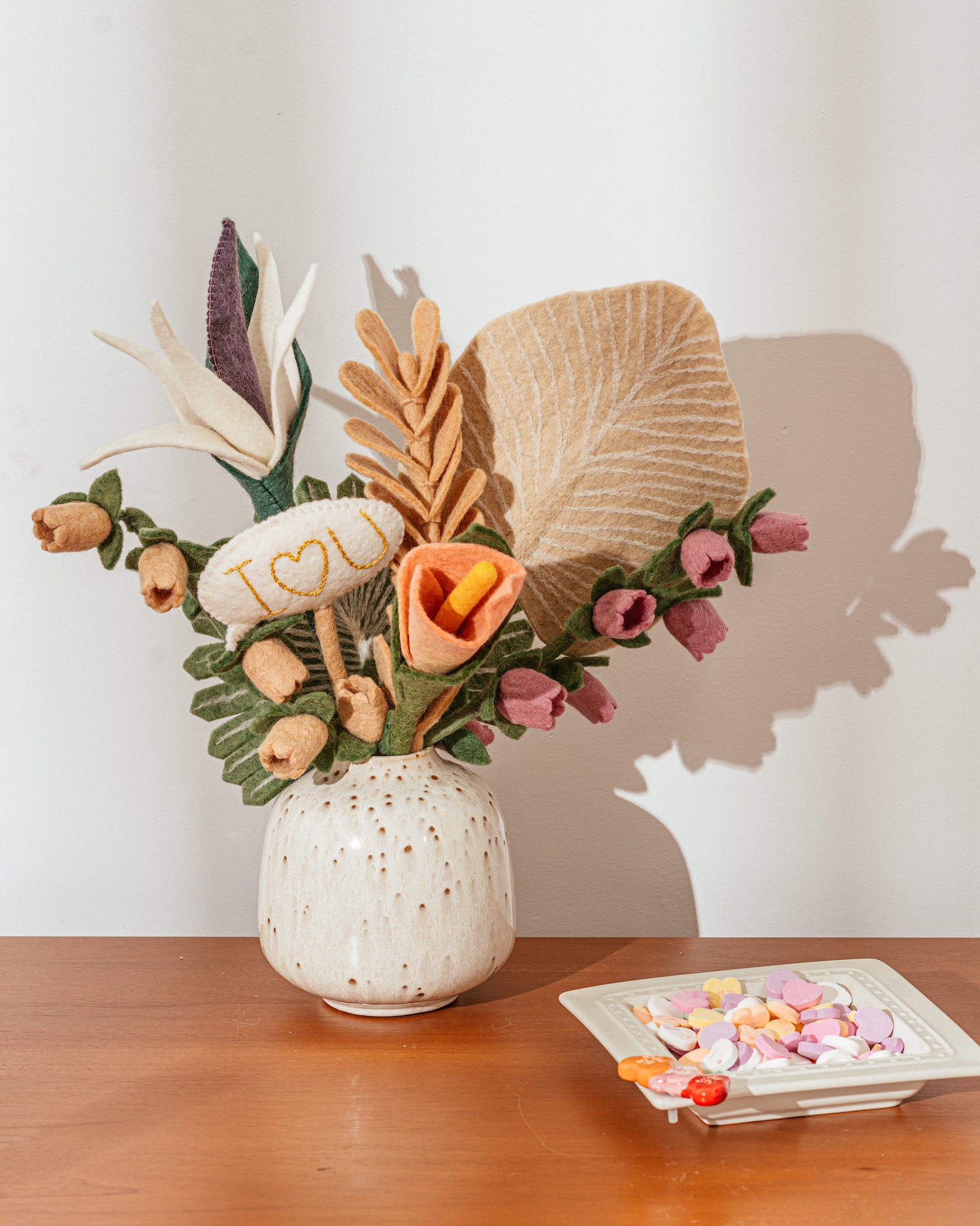 Felt Palm Leaf bouquet in vase on a table