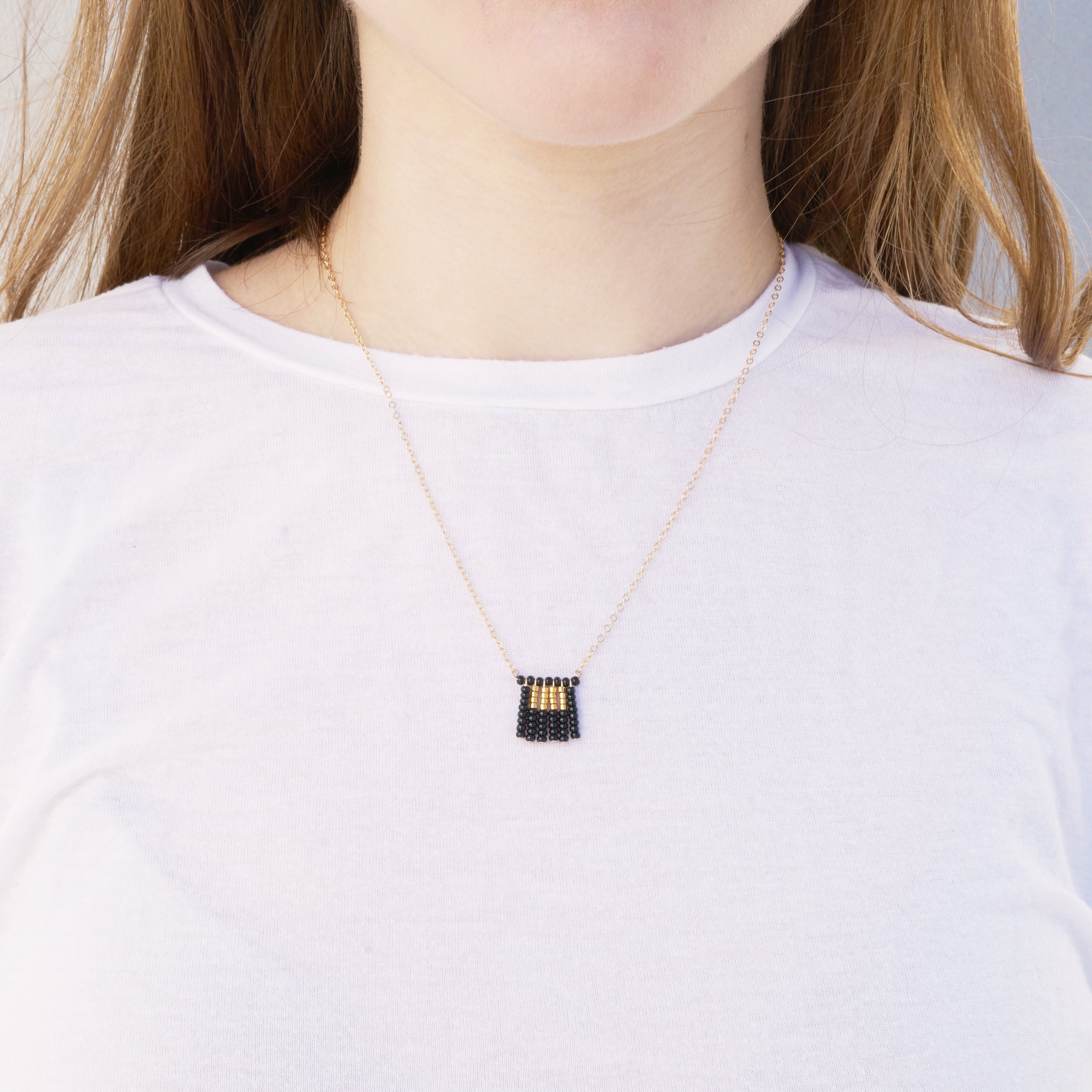 Global Goods Partners | Sidai Designs Nzuri Tassel Block Necklace Black Taupe 14k Gold Chain Glass Bead 24k Handmade Fair Trade Empower Women Artisans Gifts That Give Back Tanzania