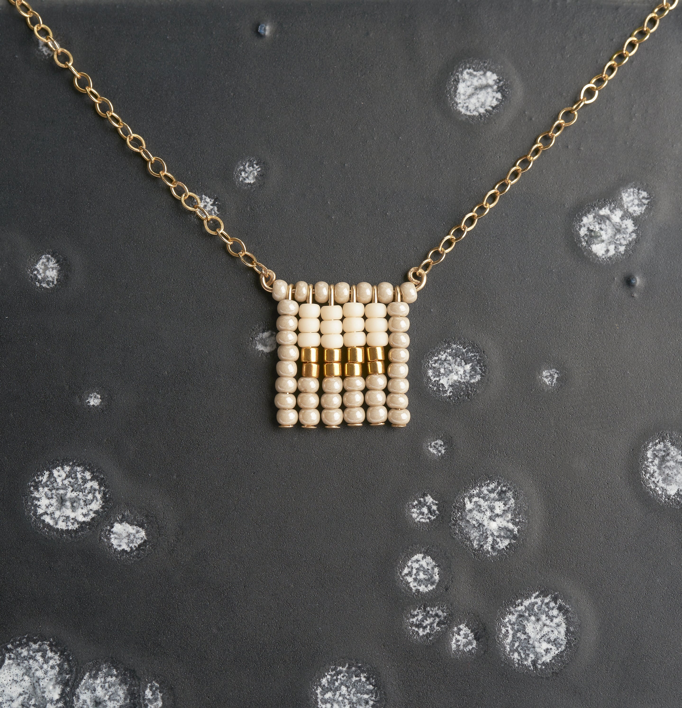 Global Goods Partners | Sidai Designs Nzuri Tassel Block Necklace Black Taupe 14k Gold Chain Glass Bead 24k Handmade Fair Trade Empower Women Artisans Gifts That Give Back Tanzania