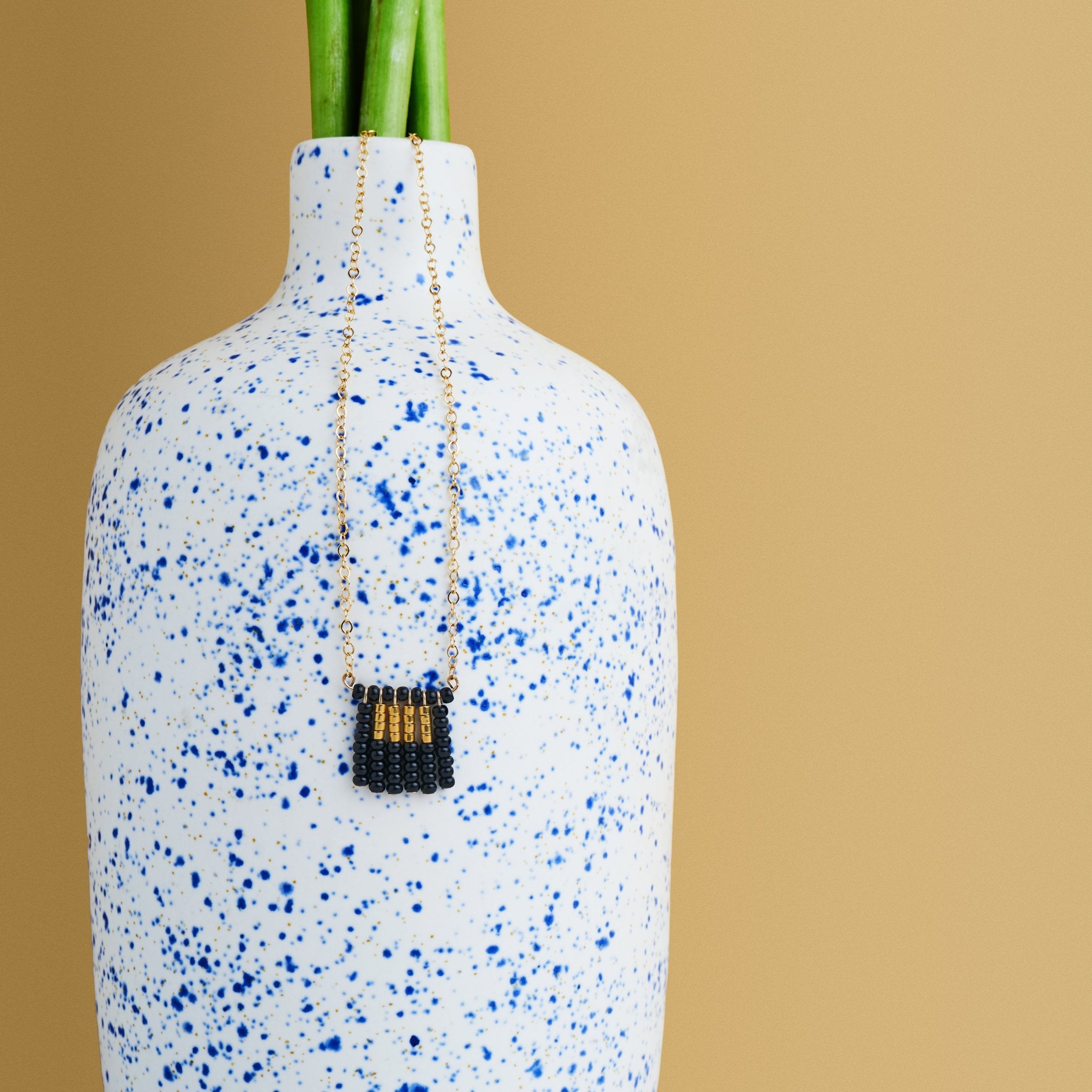 Global Goods Partners | Sidai Designs Nzuri Tassel Block Necklace Black Taupe 14k Gold Chain Glass Bead 24k Handmade Fair Trade Empower Women Artisans Gifts That Give Back Tanzania