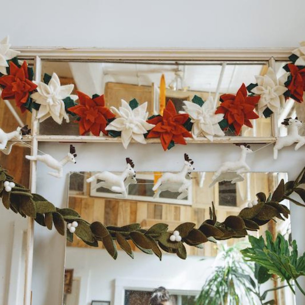 Red and White Felt Poinsettia Garland Holiday Decor Hanging in Room - Fair Trade - Global Goods Partners