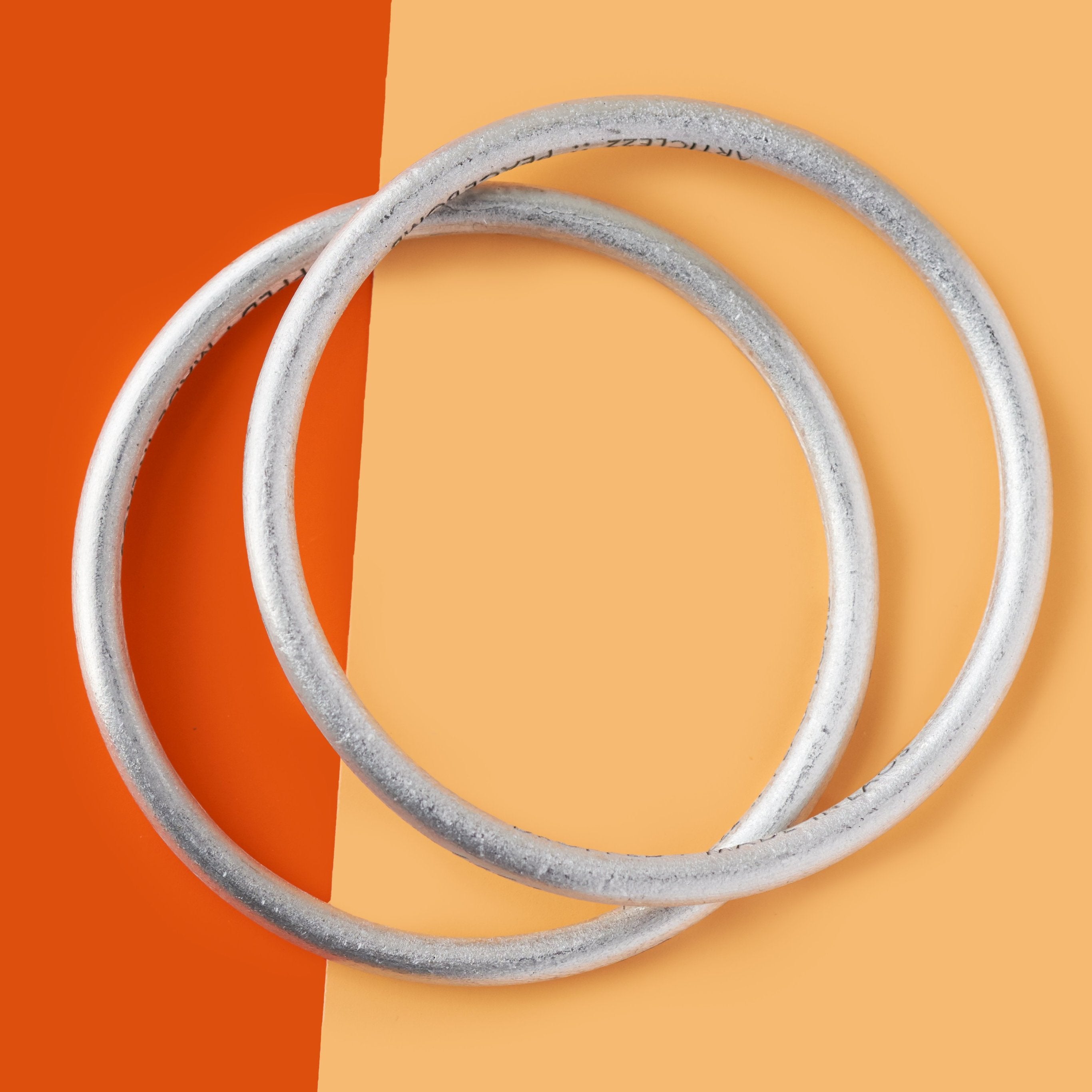 Recycled bombs aluminum Arrow Bangle handmade by Article 22 women artisans in Laos | Global Goods Partners fair trade giving back unique gifts idea for mom mother friend meaning conscious purchase gift bracelet cuff anti-war peacemaker EmmaWatson