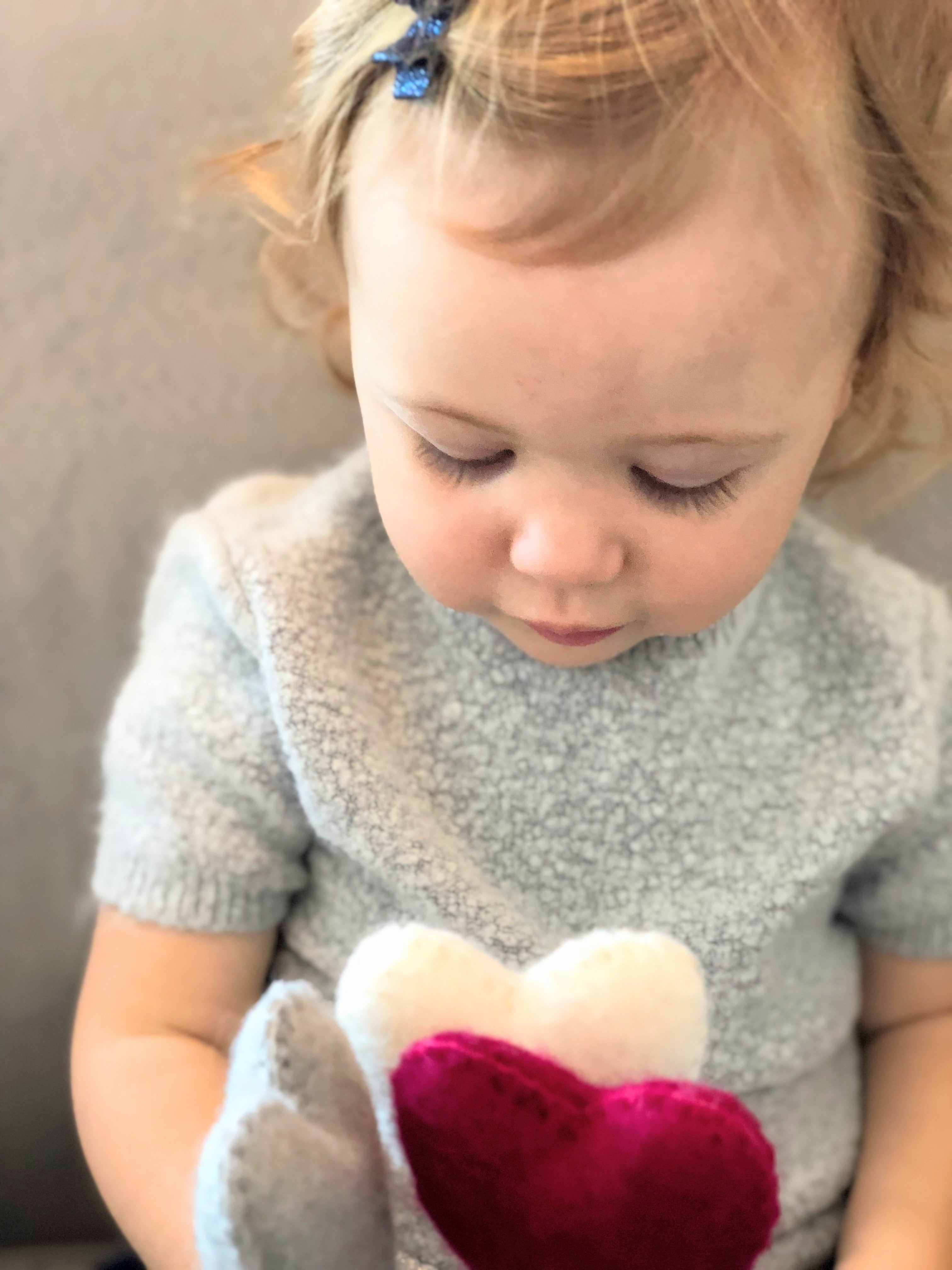 Pink Felt Heart Stem in hand - Global Goods Partners