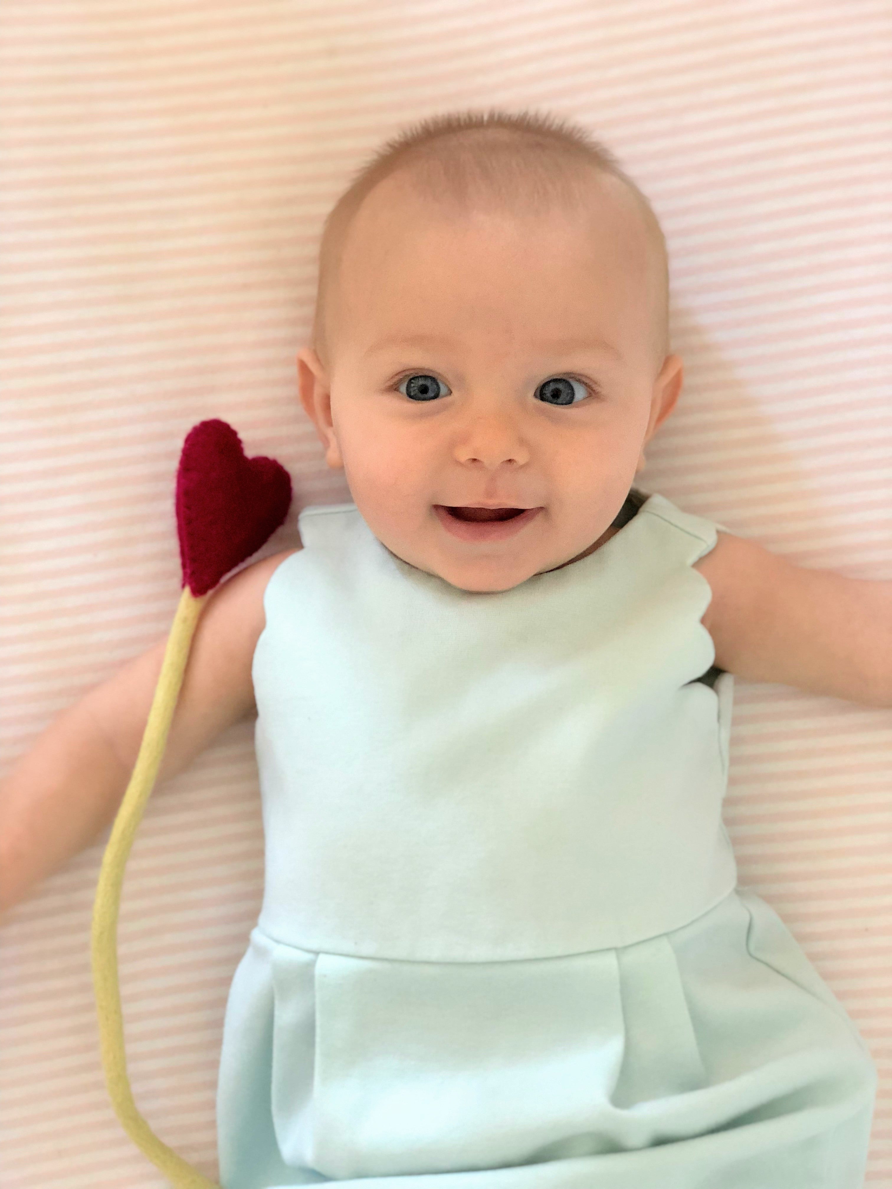 Red Felt Heart Stem in crib - Global Goods Partners