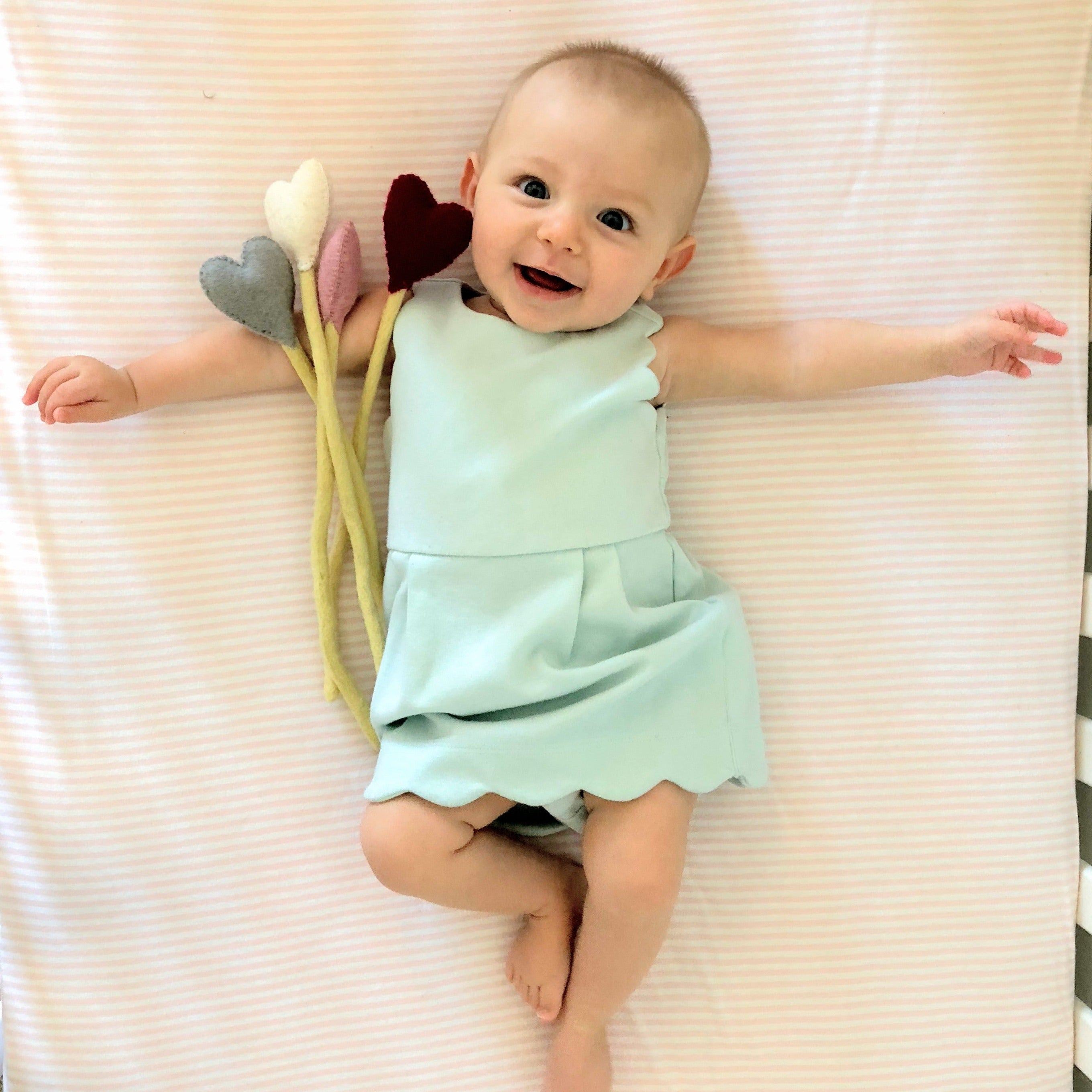 Pink Felt Heart Stems with child - Global Goods Partners