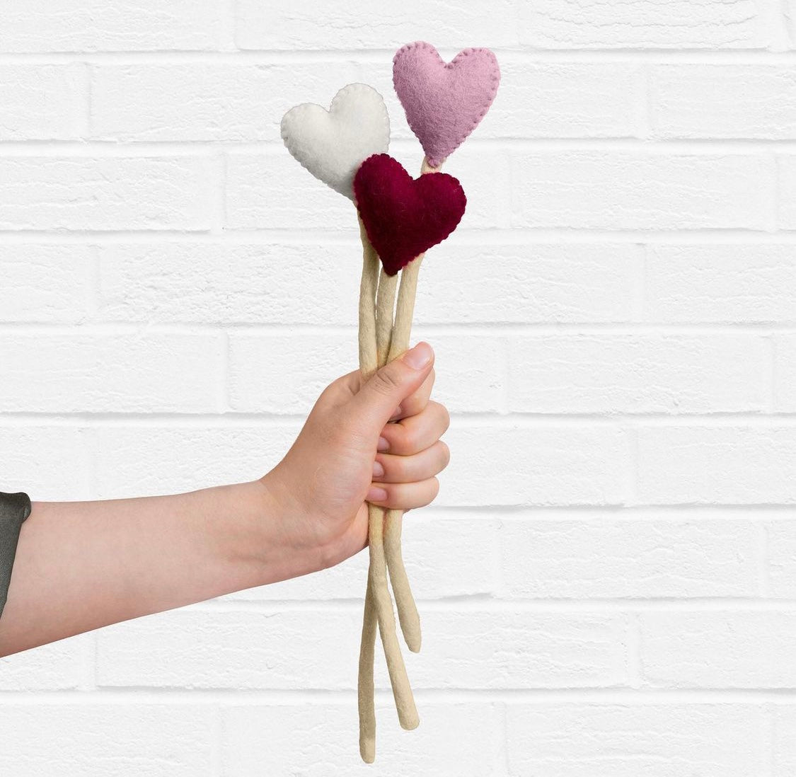 Felt Heart Stems in hand - Global Goods Partners