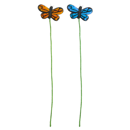 Two handmade felt butterfly stems, one orange and black, the other blue and black, on green stems against a white background. Handmade in Nepal | Global Goods Partners