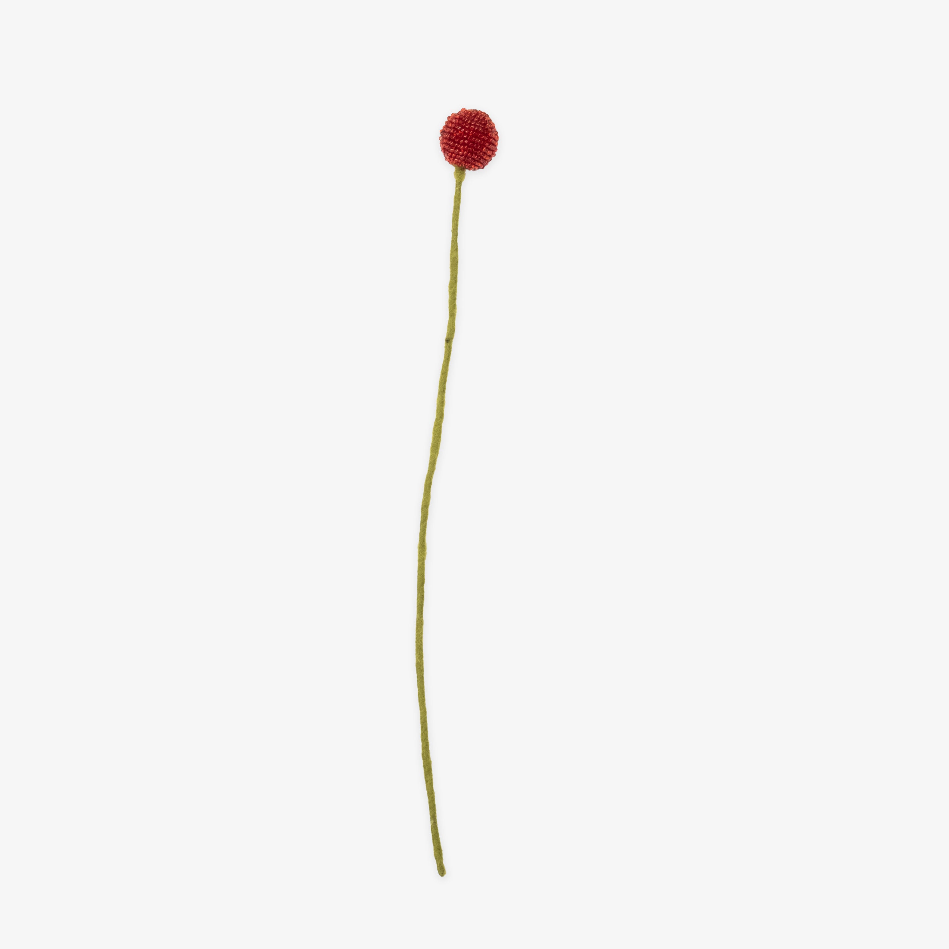 Single handmade red flower on a white background | Global Goods Partners