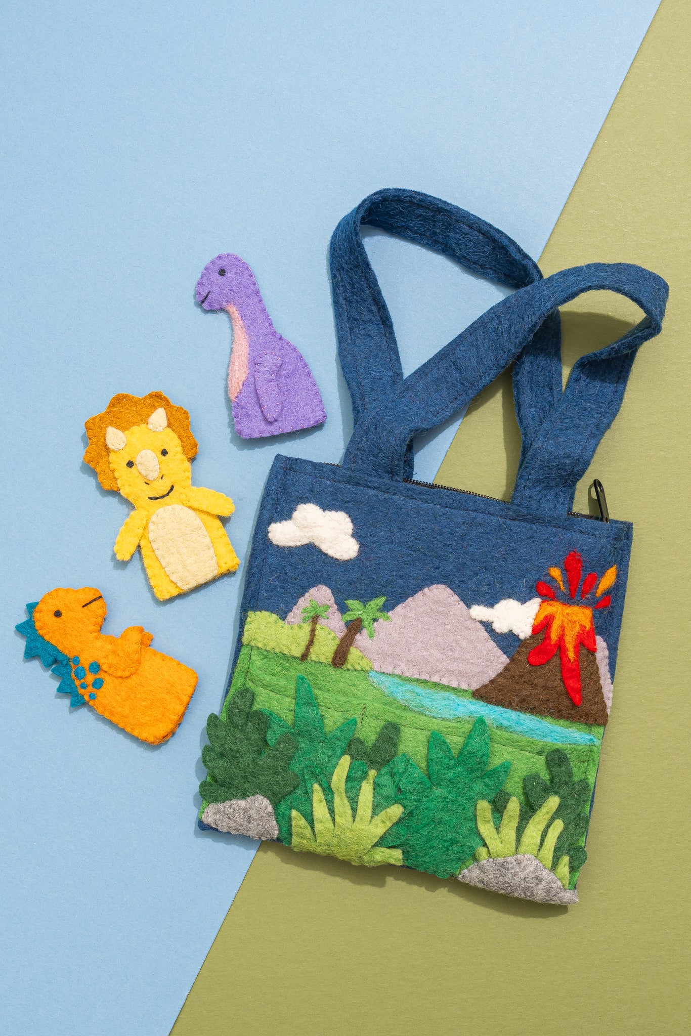 Children's felt bag with dinosaur design on a colorful background, handmade by women artisans in Nepal | Global Goods Partners