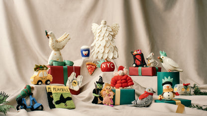 Collection of felted holiday ornament and decor on a neutral background, all handmade and fair trade.