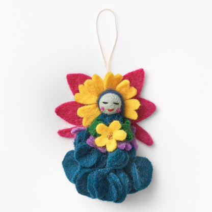 Colorful handmade, fair trade, felt ornament shaped like a flower with a small face on a white background | Global Goods Partners
