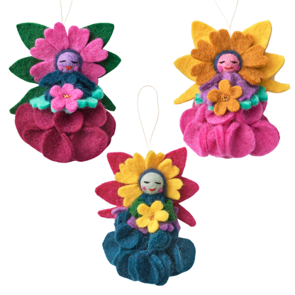 Three colorful felt flower ornaments on a white background. Fair trade made by women artisans | Global Goods Partners
