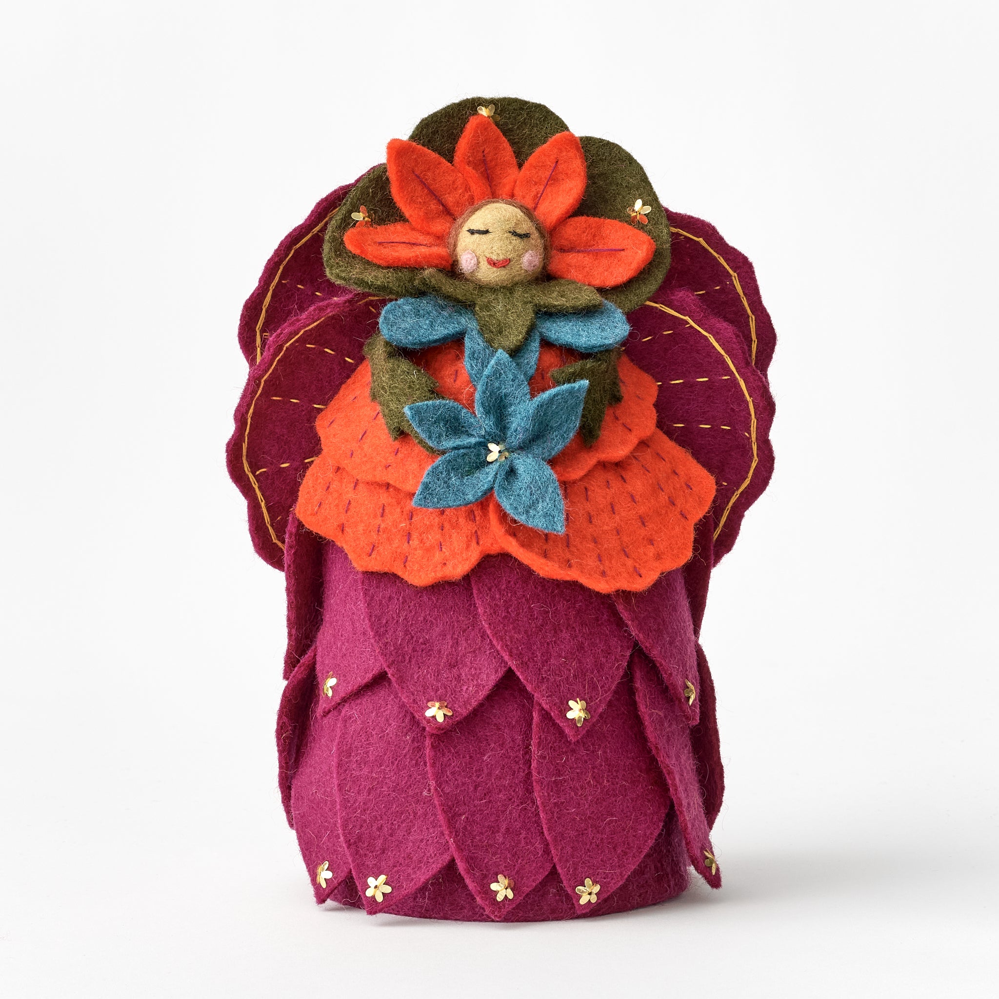 Handmade, fair trade felt tree topper resembling a flower with a smiling face on a white background | Global Goods Partners