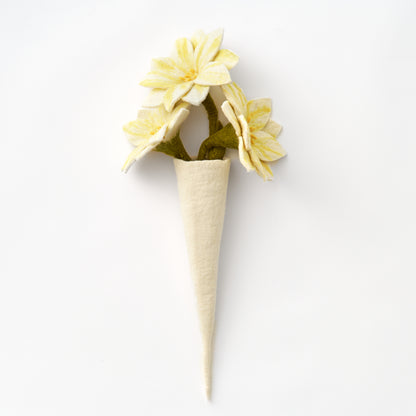 White handmade felt vase with yellow flowers on a white background | Global Goods Partners