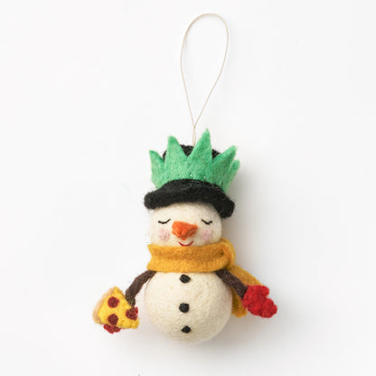 Handmade felted snowman ornament with a green hat, yellow scarf, and red gloves on a white background.