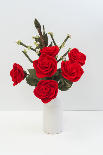 Bouquet of handmade red felt roses in a white vase on a white background | Global Goods Partners