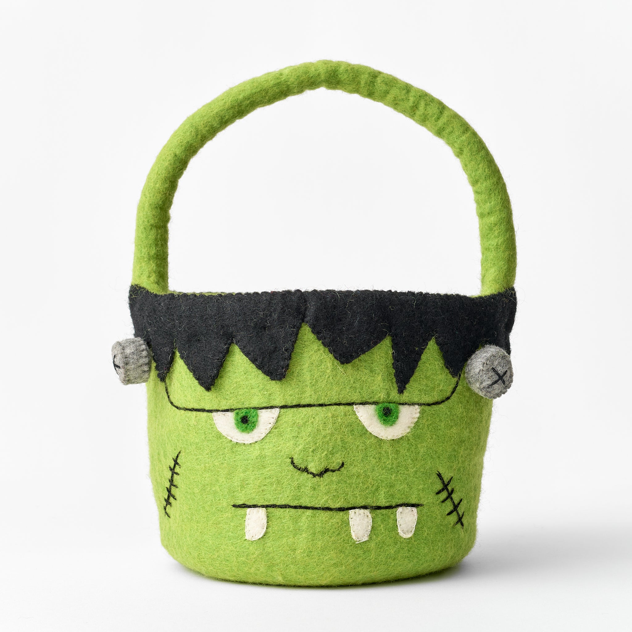 Handmade, felt, fair trade green monster-themed basket with a black top on a white background | Global Goods Partners