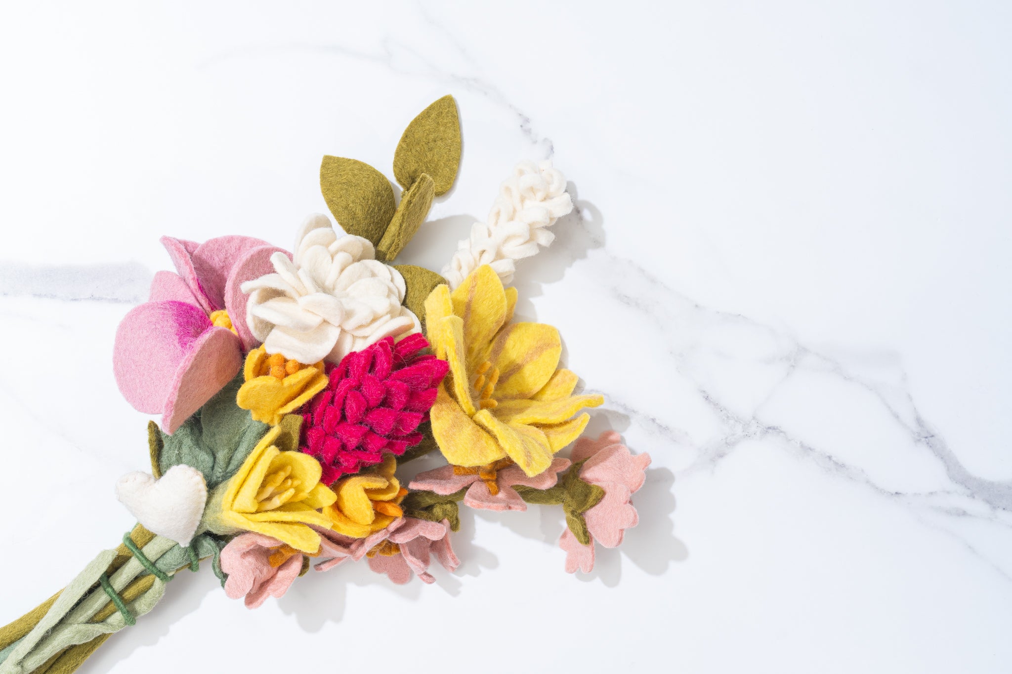 Colorful handmade artisan felt flower bouquet on a white background | Global Goods Partners