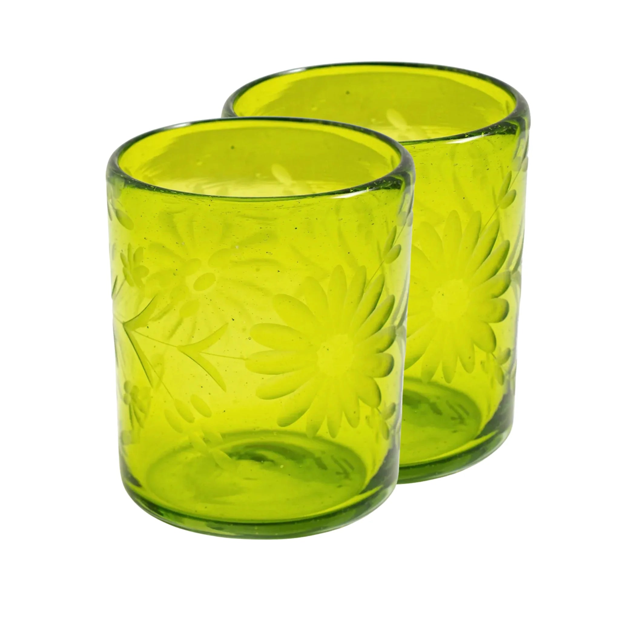 Two green glass tumblers with floral patterns on a white background | Global Goods Partners