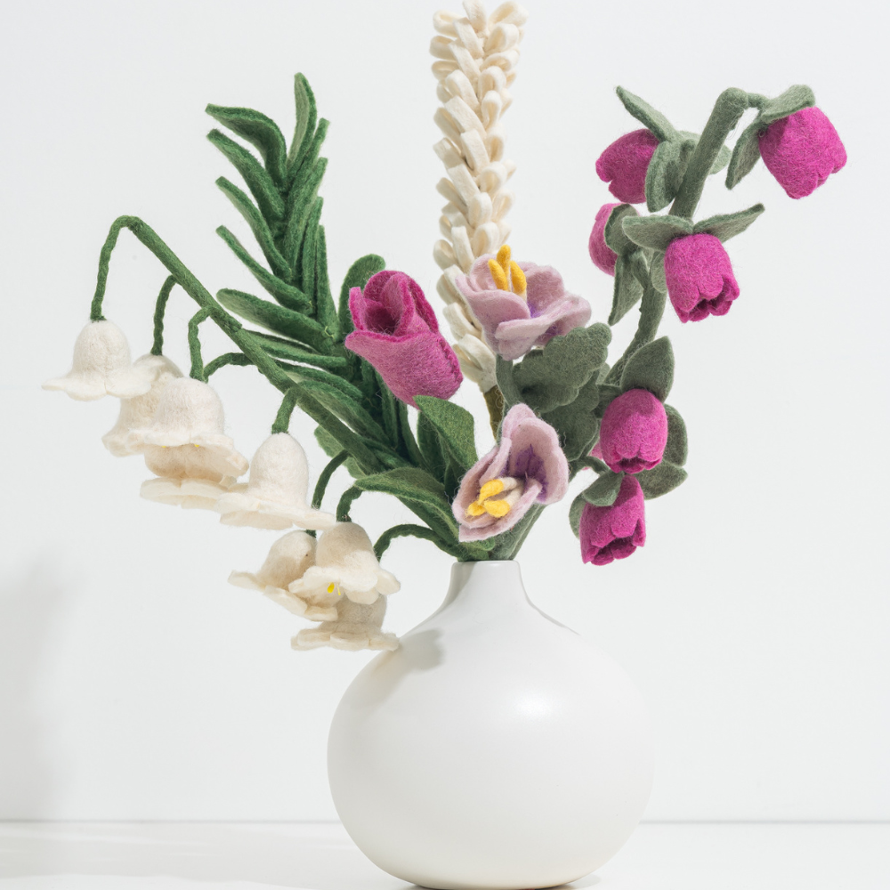 White vase with fair trade felted flowers on a white background | Global Goods Partners