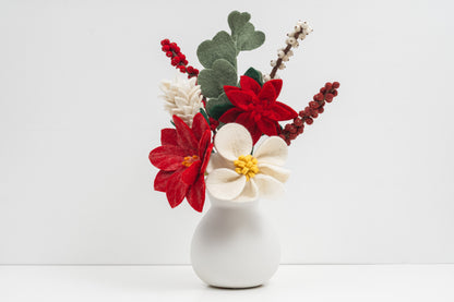 Decorative flower arrangement in a white vase on a light background. Handmade fair trade gift for loved ones | Global Goods Partners