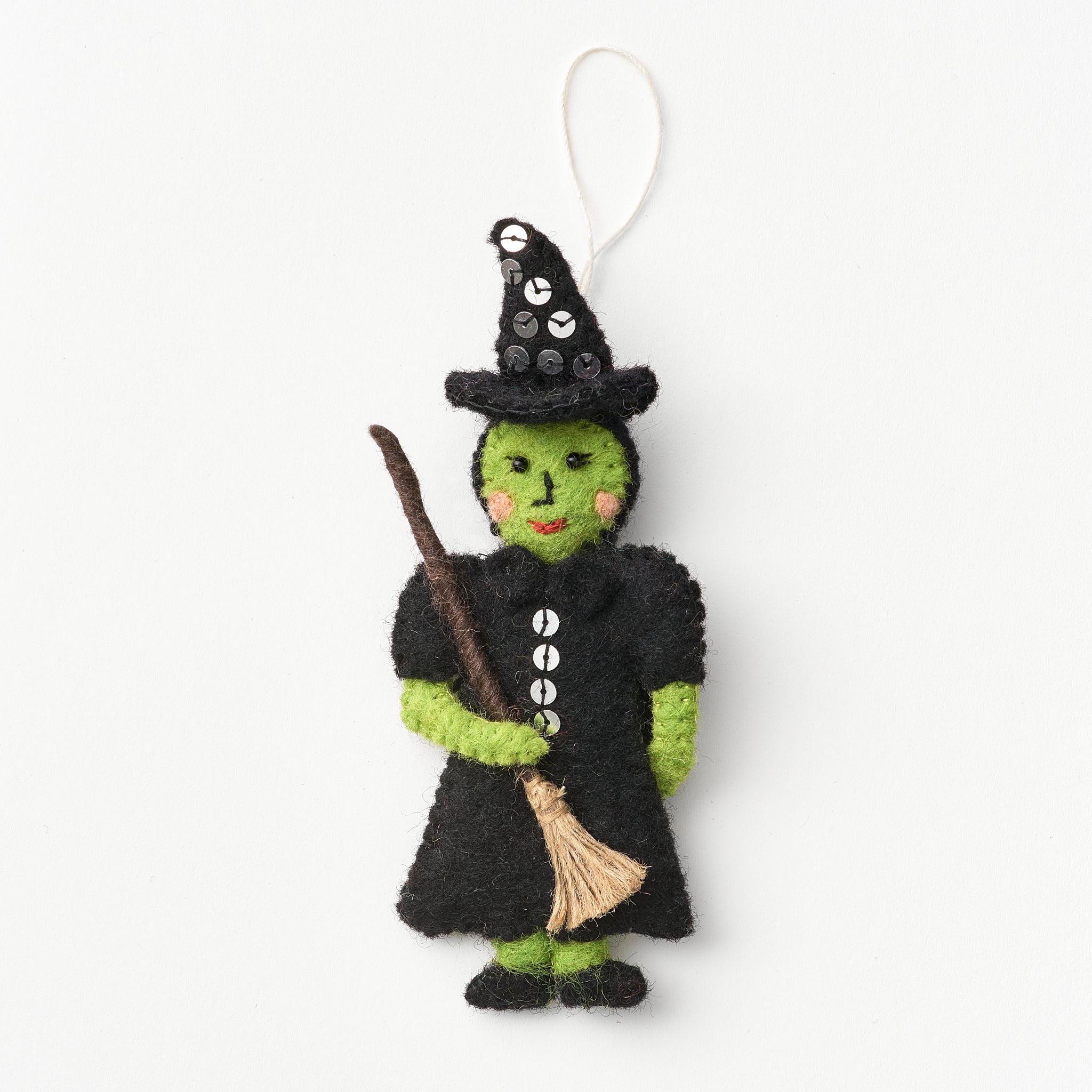 Handmade, fair trade, felt wicked witch Elphaba ornament with a broom on a white background | Global Goods Partners