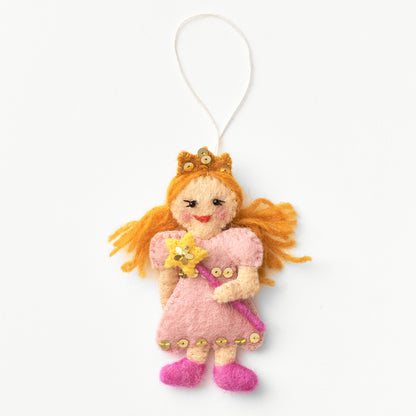 Artisan-made felt Glinda ornament with blonde hair and a pink dress holding a yellow star wand, hanging from a string on a white background | Global Goods Partners