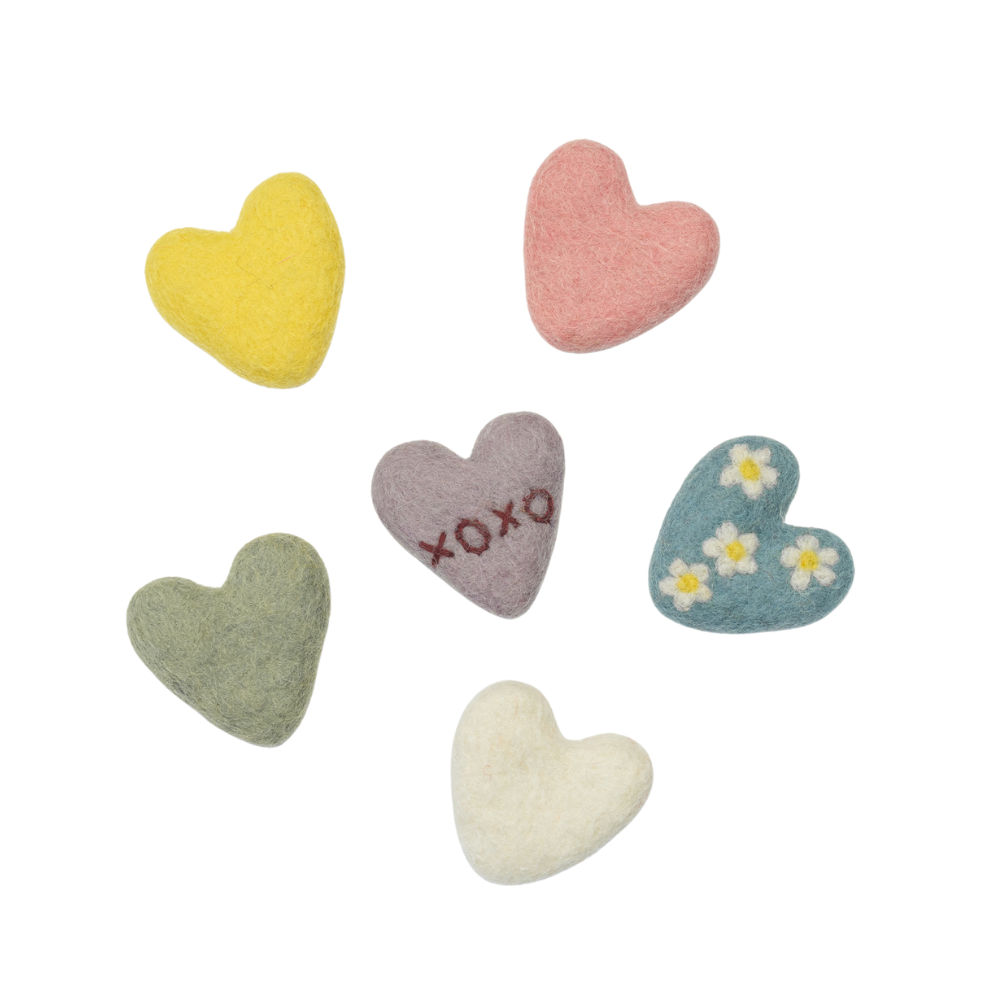 Set of handmade colorful heart-shaped plush toys on a white background | Global Goods Partners