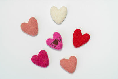 Set of fair trade colorful heart-shaped felt decorations made by women artisans in Nepal on a white background | Global Goods Partners