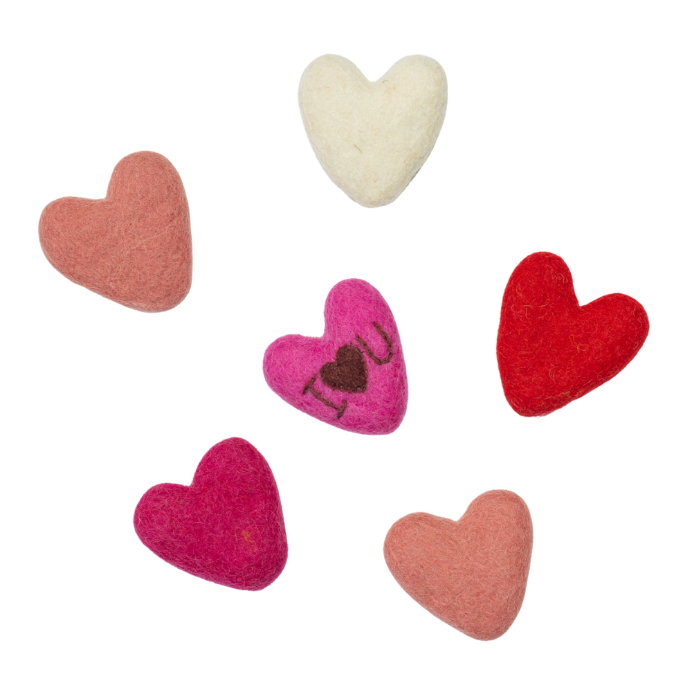 Set of heart-shaped felt toys in various colors on a white background | Global Goods Partners